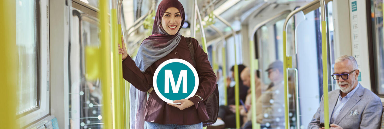 Transport for NSW Metro passenger holding signage inside carriage.